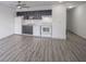 Open kitchen and living area with modern appliances and seamless flooring at 102 Clarendon Dr # 506, Noblesville, IN 46062