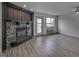 Inviting living room featuring a stone fireplace and an adjacent walkout at 102 Clarendon Dr # 506, Noblesville, IN 46062