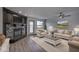 Cozy living room with a stone fireplace, comfortable seating, and abundant natural light at 102 Clarendon Dr # 506, Noblesville, IN 46062