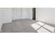 Bedroom featuring light-colored carpet and a door leading to the bathroom at 10250 Camp Creek Way, Indianapolis, IN 46229