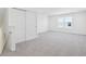 Bonus room featuring a sliding door closet, window, and neutral carpet throughout at 10250 Camp Creek Way, Indianapolis, IN 46229
