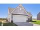 Well maintained single-Gathering home with two-car garage and well manicured front lawn at 10250 Camp Creek Way, Indianapolis, IN 46229