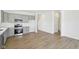 Open-concept kitchen with modern gray cabinets, stainless steel appliances and plenty of space at 10250 Camp Creek Way, Indianapolis, IN 46229