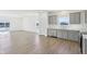 Contemporary eat-in kitchen featuring gray cabinets, stainless steel appliances, and a scenic view at 10250 Camp Creek Way, Indianapolis, IN 46229