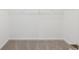 Walk-in closet with carpeted floors and built-in storage at 10250 Camp Creek Way, Indianapolis, IN 46229