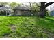 Back exterior showing a patio, lawn, and tree at 112 Coronado Rd, Indianapolis, IN 46234