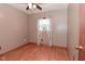Neutral bedroom features light brown walls and wood-look laminate flooring at 112 Coronado Rd, Indianapolis, IN 46234
