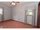 Carpet-free bedroom with blue textured walls and updated ceiling fan at 112 Coronado Rd, Indianapolis, IN 46234