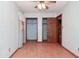 Blue bedroom with wood look flooring, closet and ensuite access at 112 Coronado Rd, Indianapolis, IN 46234