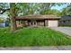 Charming single-story home featuring a lawn, attached garage, and inviting curb appeal at 112 Coronado Rd, Indianapolis, IN 46234