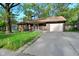 View of a single-story home featuring a driveway and attached garage at 112 Coronado Rd, Indianapolis, IN 46234