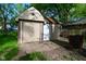 Detached garage features both a traditional door and garage door with brick pathway at 112 Coronado Rd, Indianapolis, IN 46234