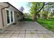 Concrete backyard patio featuring pavers and a clay chiminea at 112 Coronado Rd, Indianapolis, IN 46234