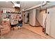 Unfinished basement with storage boxes and concrete floor leading up to stairs at 114 E 27Th St, Indianapolis, IN 46205