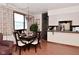 Well-lit dining area with a table set for a meal, connected to the kitchen at 114 E 27Th St, Indianapolis, IN 46205