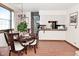 Elegant dining room with wood flooring, and adjacent access to the kitchen at 114 E 27Th St, Indianapolis, IN 46205