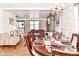 A dining room flowing to the living room with wood floors and lots of light at 114 E 27Th St, Indianapolis, IN 46205