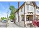 A townhouse exterior showing the entry and garage on a sunny day at 114 E 27Th St, Indianapolis, IN 46205