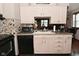 Traditional kitchen with stainless steel microwave, backsplash, and black dishwasher at 114 E 27Th St, Indianapolis, IN 46205