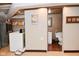 Basement laundry room with a washer, dryer, and sliding door access to bathroom at 114 E 27Th St, Indianapolis, IN 46205
