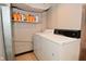 Simple laundry area with a standard white washer and dryer setup at 114 E 27Th St, Indianapolis, IN 46205