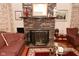 Charming living room with a brick fireplace, traditional decor, and comfortable seating at 114 E 27Th St, Indianapolis, IN 46205