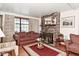 Cozy living area with a brick fireplace, a plush sofa, and lots of natural light at 114 E 27Th St, Indianapolis, IN 46205
