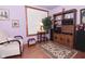Comfortable living room features a patterned chair, rug, and built-in wooden shelving at 114 E 27Th St, Indianapolis, IN 46205