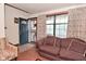 Comfortable living room featuring a cozy sofa, patterned curtains, and natural light at 114 E 27Th St, Indianapolis, IN 46205