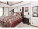 Spacious bedroom with decorative pillars, patterned bedding, and accent lighting at 114 E 27Th St, Indianapolis, IN 46205