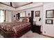 Spacious main bedroom featuring tray ceilings, warm colors, and ample natural light at 114 E 27Th St, Indianapolis, IN 46205