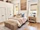Stylish bedroom showcasing soft natural light, a cozy bed, and coordinated decor at 114 S Walnut St, Muncie, IN 47305