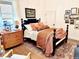 Cozy bedroom showcasing classic furnishings and an antique rug at 114 S Walnut St, Muncie, IN 47305