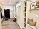 Hallway with lots of storage space, cabinets, and a seating area with pillows at 114 S Walnut St, Muncie, IN 47305