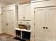 Hallway built-in storage with cabinets and drawers, plus pet storage underneath at 114 S Walnut St, Muncie, IN 47305