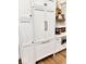 New kitchen features white cabinets, and stainless-steel appliances at 114 S Walnut St, Muncie, IN 47305