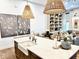 Open kitchen with a large island, farmhouse sink, and decorative pendant lights over barstool seating at 114 S Walnut St, Muncie, IN 47305