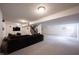 Finished basement with carpet, a dark couch, TV, stairs and speakers at 12493 Loudoun Pl, Fishers, IN 46037