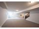 Finished basement with neutral paint, carpet, a window, and stairs at 12493 Loudoun Pl, Fishers, IN 46037