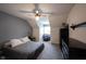 Bedroom featuring gray and white walls, carpet flooring, a queen-sized bed, and a ceiling fan with integrated lighting at 12493 Loudoun Pl, Fishers, IN 46037