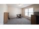 Bonus room features neutral walls, carpet, and a small table and chair set at 12493 Loudoun Pl, Fishers, IN 46037