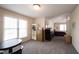 Bonus room features neutral walls, carpet, and a large window allowing natural light to fill the space at 12493 Loudoun Pl, Fishers, IN 46037