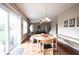 Bright dining area features hardwood floors, round table, and sliding glass doors to the outdoor patio at 12493 Loudoun Pl, Fishers, IN 46037