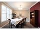 Traditional dining room features neutral walls and a large window allowing natural light to fill the space at 12493 Loudoun Pl, Fishers, IN 46037