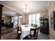 This traditional dining room features neutral walls and a large window allowing natural light to fill the space at 12493 Loudoun Pl, Fishers, IN 46037