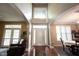 Inviting foyer with hardwood floors and arched entryways into living spaces at 12493 Loudoun Pl, Fishers, IN 46037