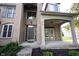 Covered front porch and entryway featuring brick facade and well-maintained landscaping at 12493 Loudoun Pl, Fishers, IN 46037