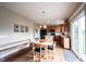 Kitchen with dining table, wooden cabinetry, and sliding glass doors at 12493 Loudoun Pl, Fishers, IN 46037