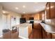 Kitchen with wooden cabinetry, central island, and modern appliances at 12493 Loudoun Pl, Fishers, IN 46037