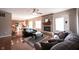 Open concept living room flows into the kitchen, featuring a fireplace, hardwood floors, and lots of light at 12493 Loudoun Pl, Fishers, IN 46037